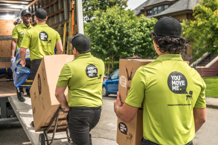 professional movers loading boxes on truck