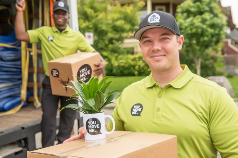 You Move Me movers holding moving boxes